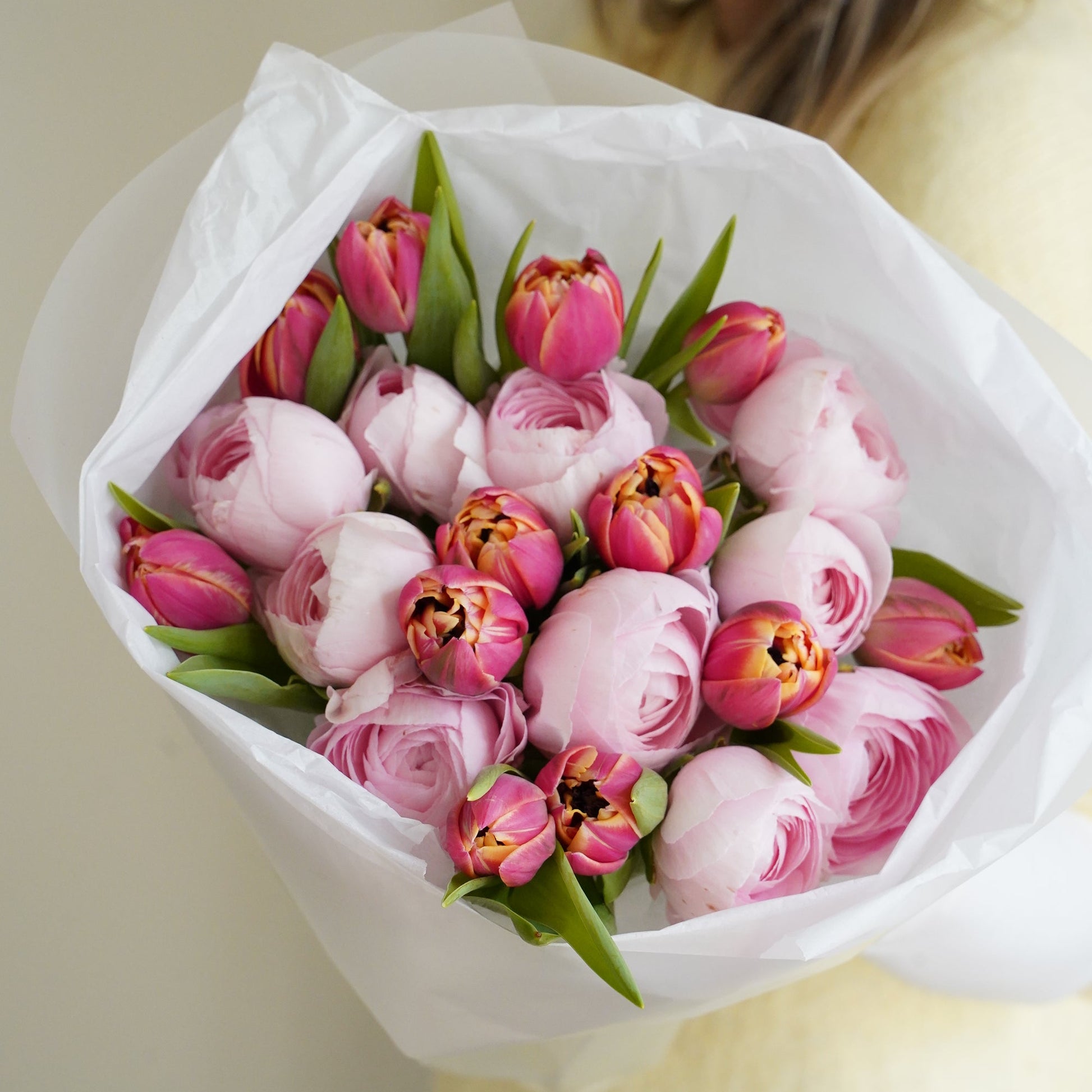Blush ranunculus and tulips bouquet close up, elegant pastel floral arrangement Portugal