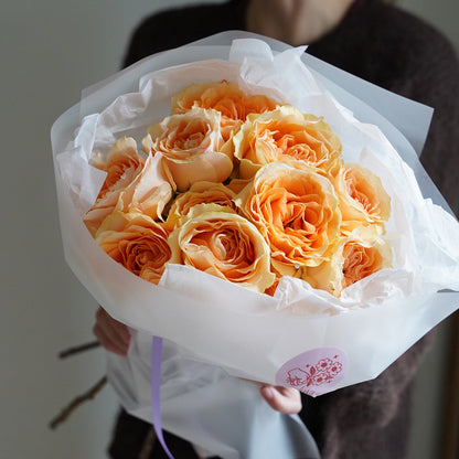 Peach roses bouquet with 21 stems, romantic peach-colored roses wrapped in white paper