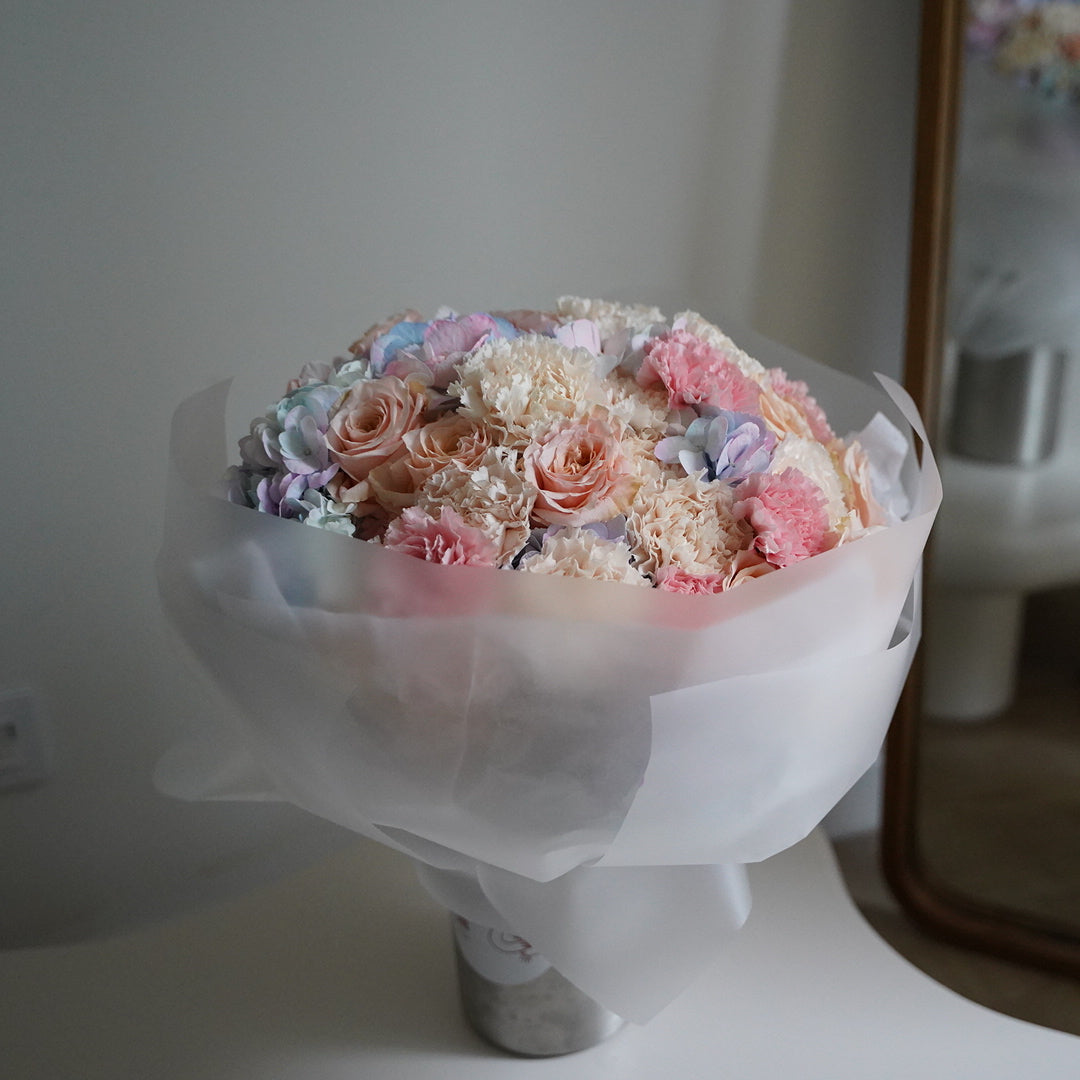 Pastel bouquet with blush roses carnations and hydrangea in soft pink and blue tones, elegant flower delivery Lisbon