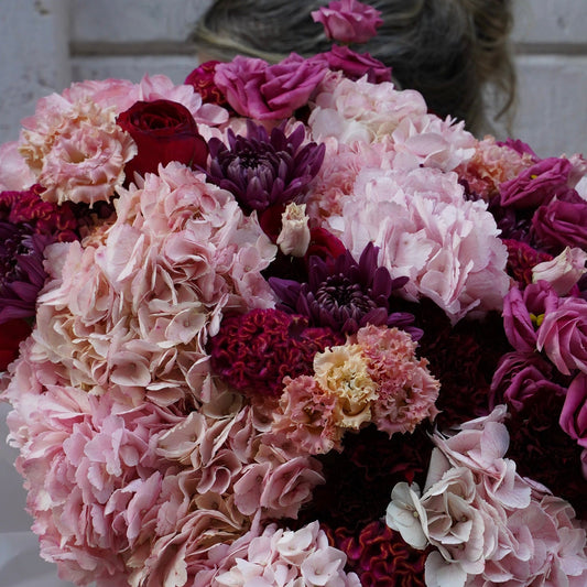 Bouquet of pink and purple flowers with a blurred background